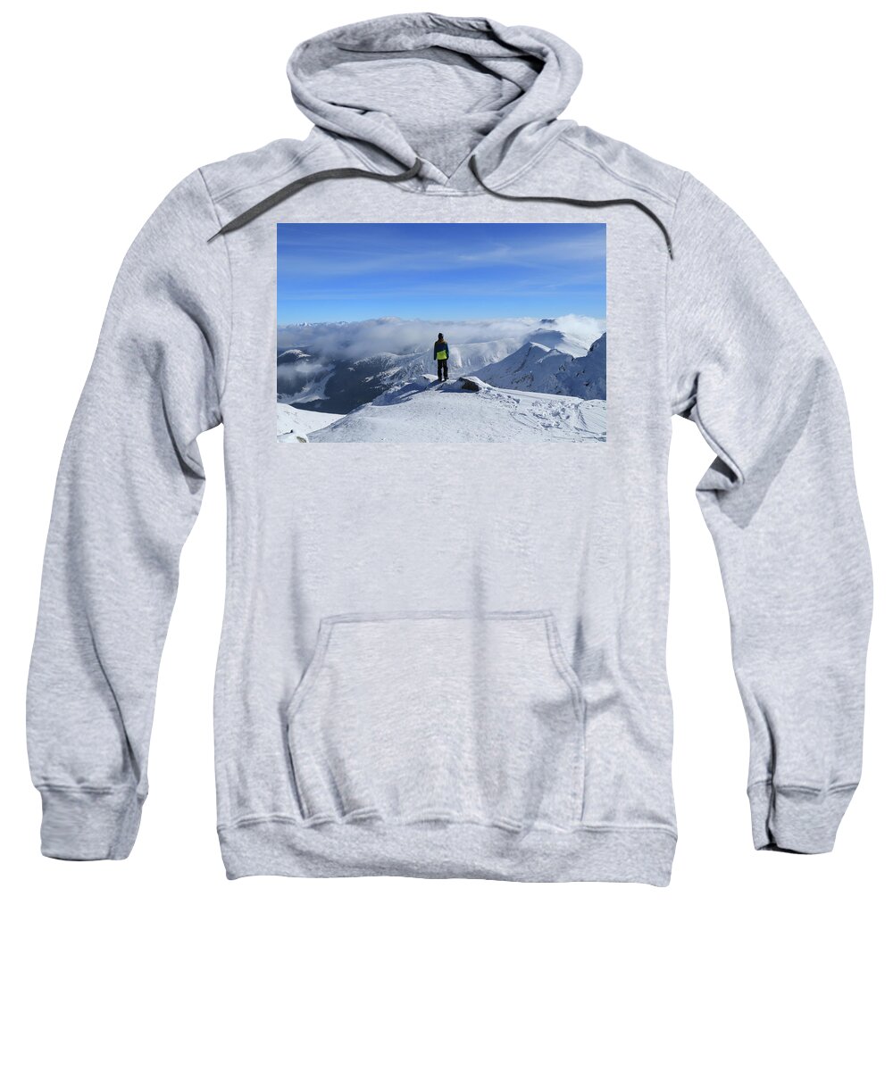 View Sweatshirt featuring the photograph Magical panorama on peak of Chopok with view to High Tatras and Dumbier. Young skier enjoy freedom and paradise looks. Man in colorful ski clothes stand on the edge of mountain and watchs landscape by Vaclav Sonnek