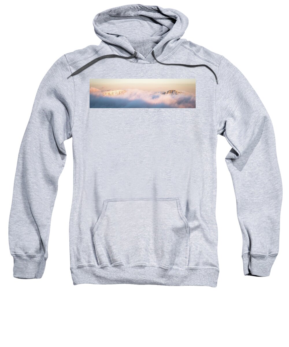 Abstract Sweatshirt featuring the photograph Two peaks emerge from purple clouds at sunset by Jean-Luc Farges