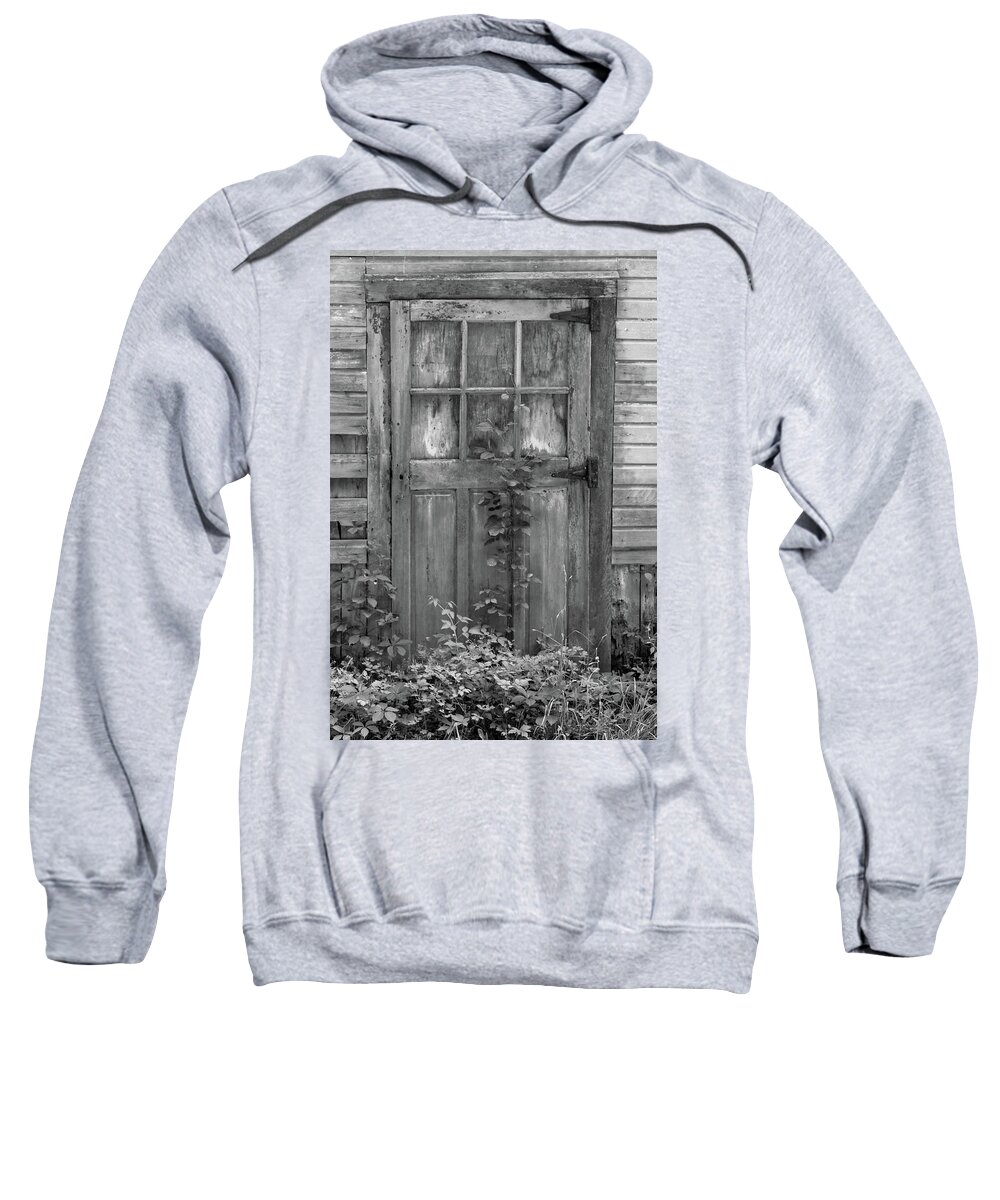 Black And White Barn Sweatshirt featuring the photograph Weathered Wood Barn Door with Vine by David Letts