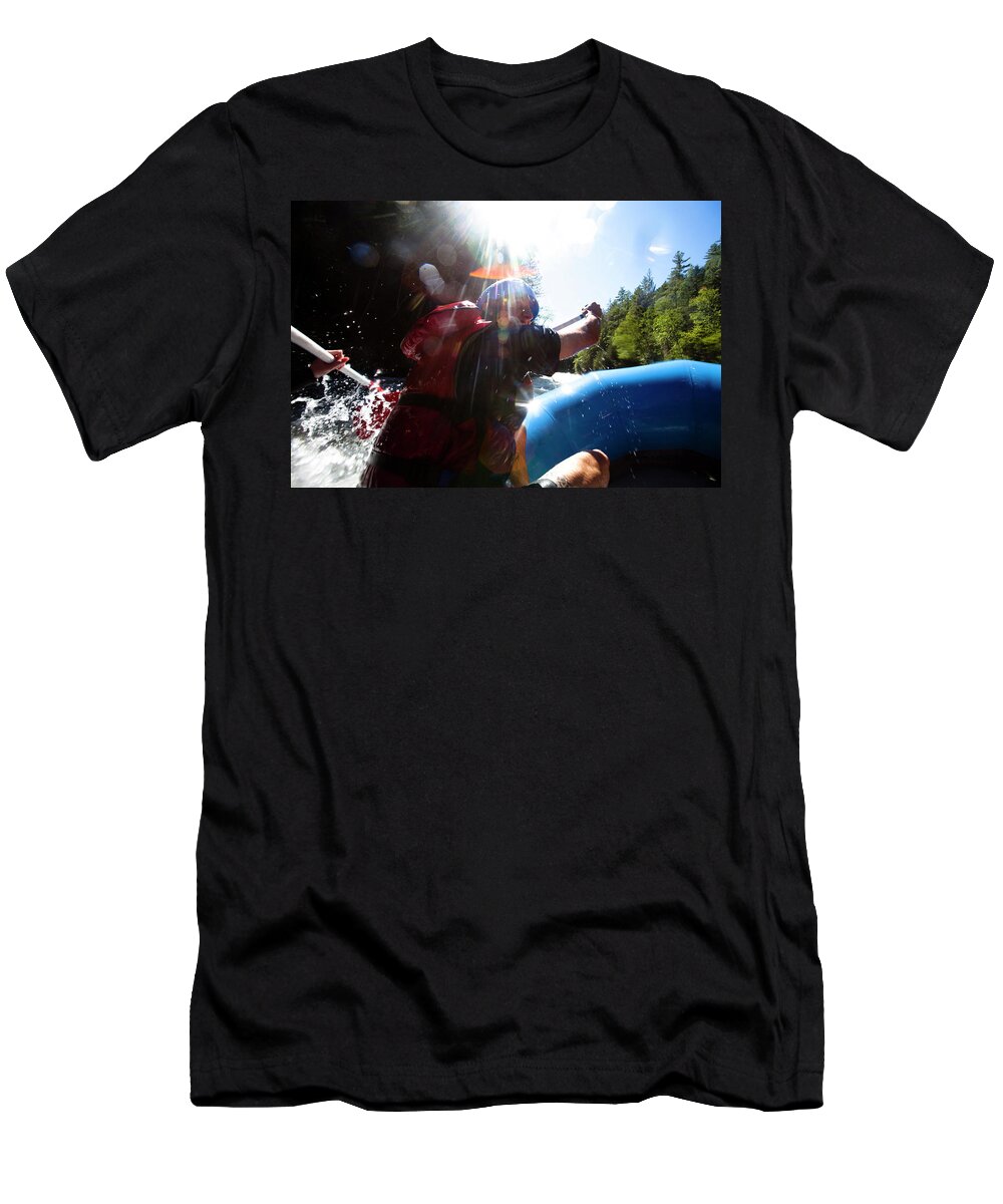 20-24 Years T-Shirt featuring the photograph A Young Man Paddles Down A River While by Kyle Sparks