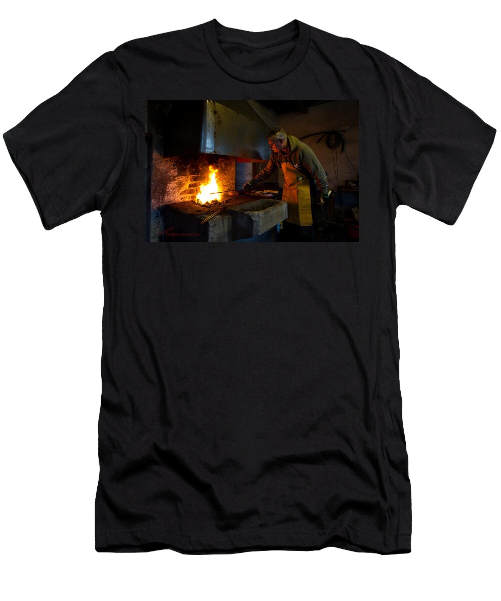 The Torresta Blacksmith T-Shirt featuring the photograph The Torresta Blacksmith by Torbjorn Swenelius