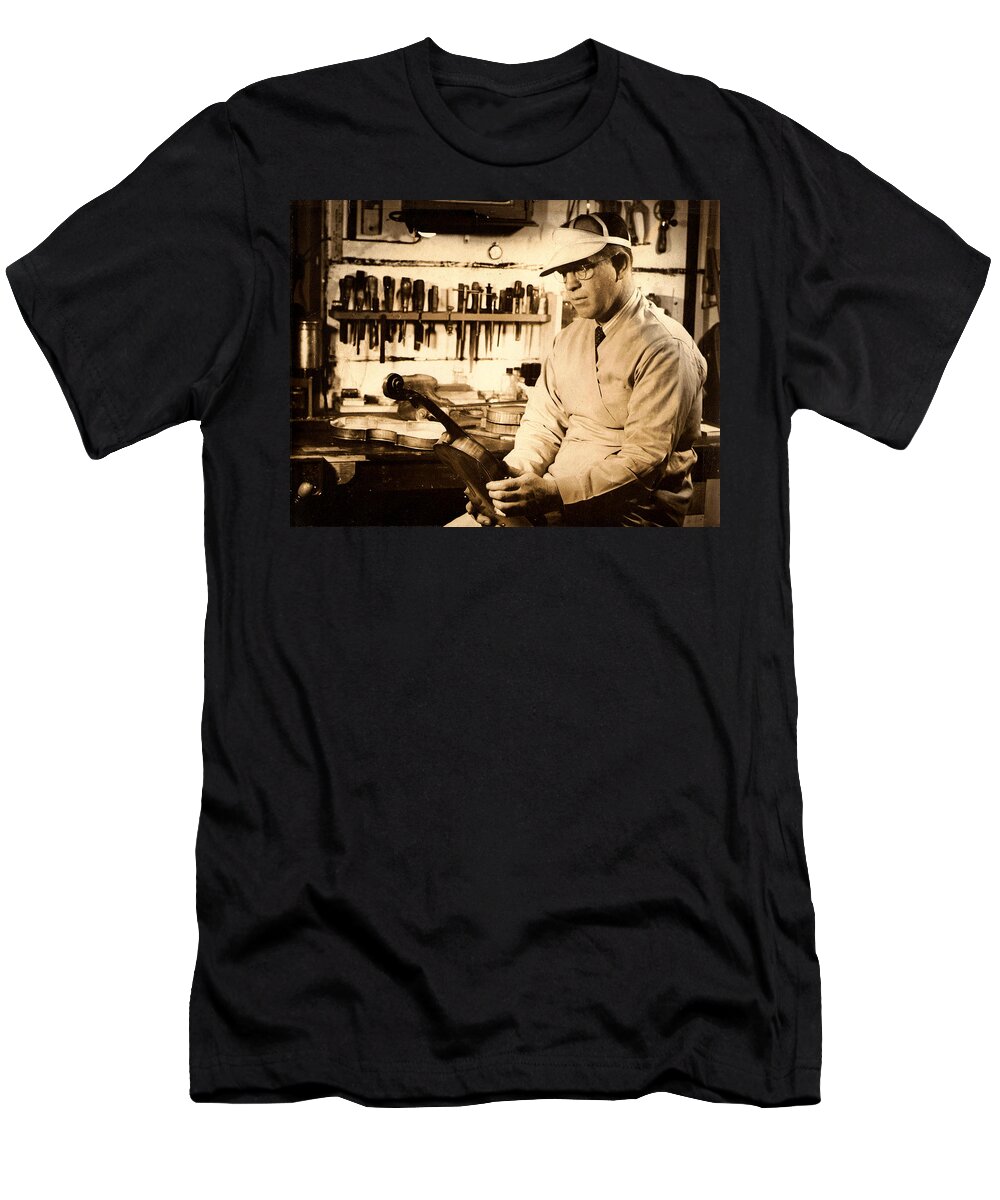 The Violin Maker T-Shirt featuring the photograph The Violin Maker by Kiki Art