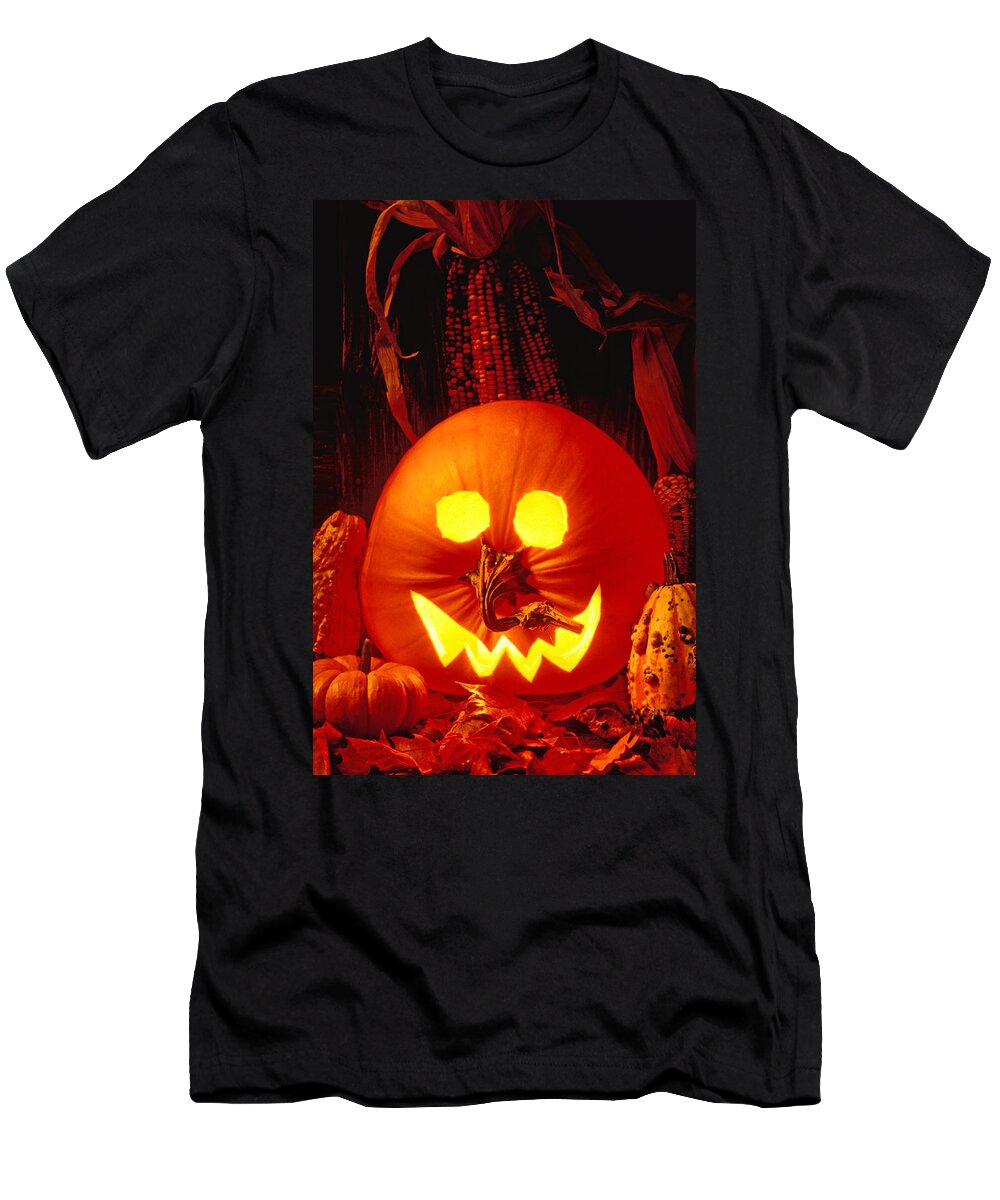 Pumpkin T-Shirt featuring the photograph Carved pumpkin with fall leaves by Garry Gay