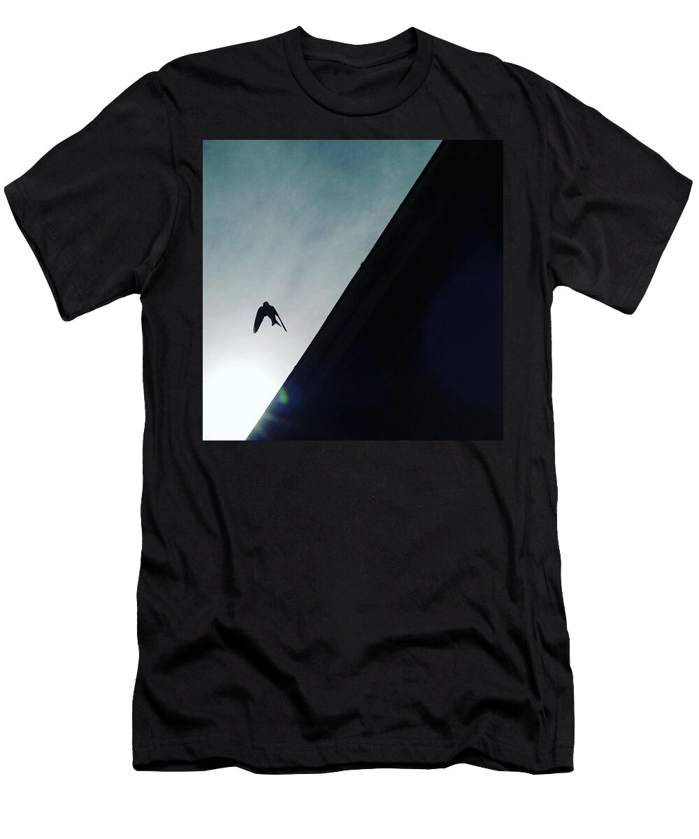Flight T-Shirt featuring the photograph A Bird Captured In Flight by Aleck Cartwright