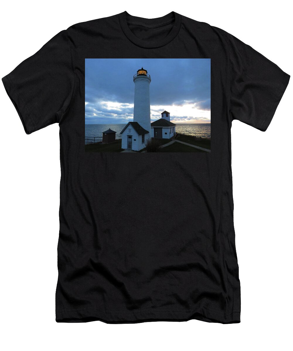 The Light At Tibbetts Point Lighthouse Shines With The December Clouds T-Shirt featuring the photograph December light, Tibbetts Point by Dennis McCarthy