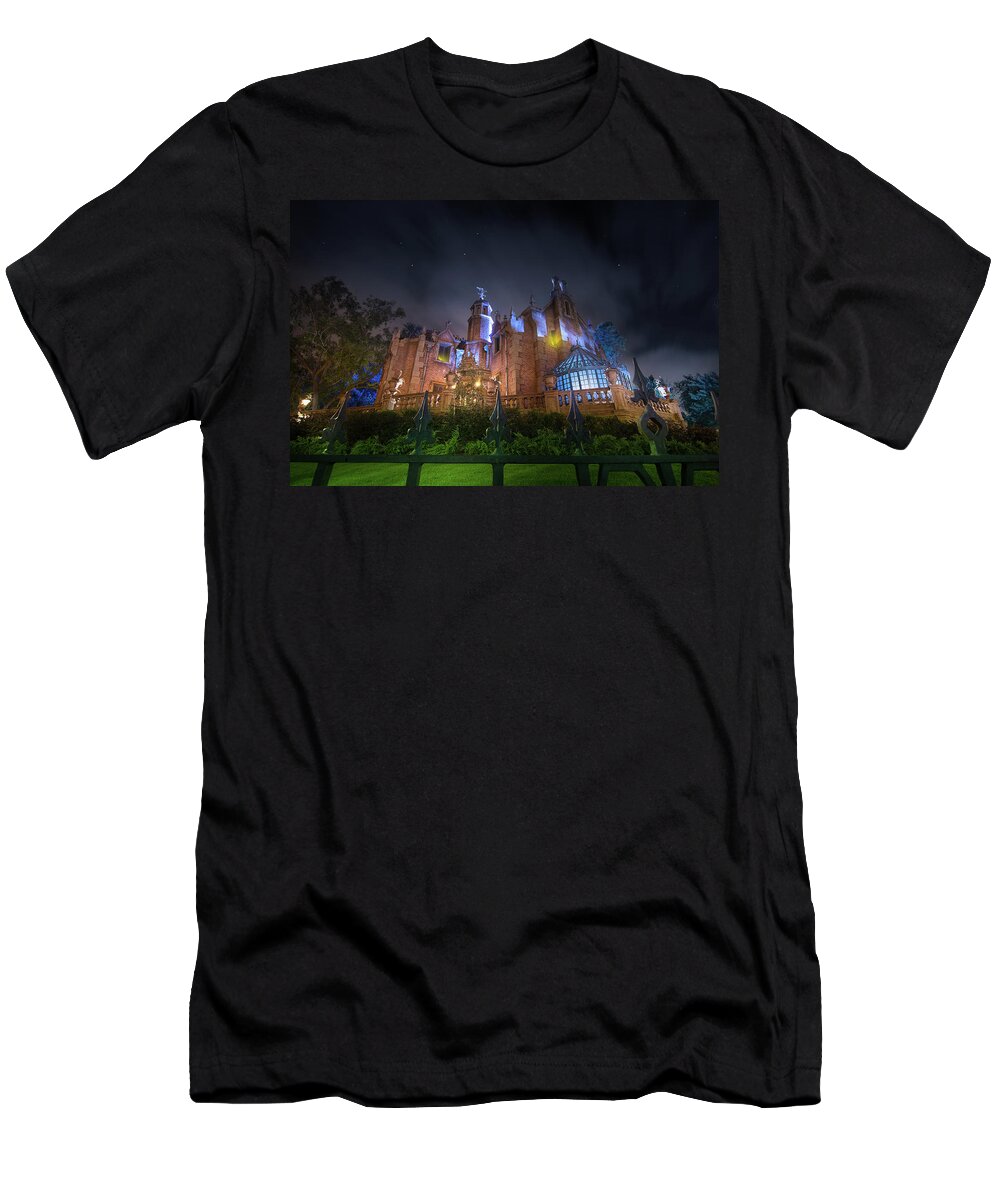 Magic Kingdom T-Shirt featuring the photograph A Night in the Haunted Mansion by Mark Andrew Thomas