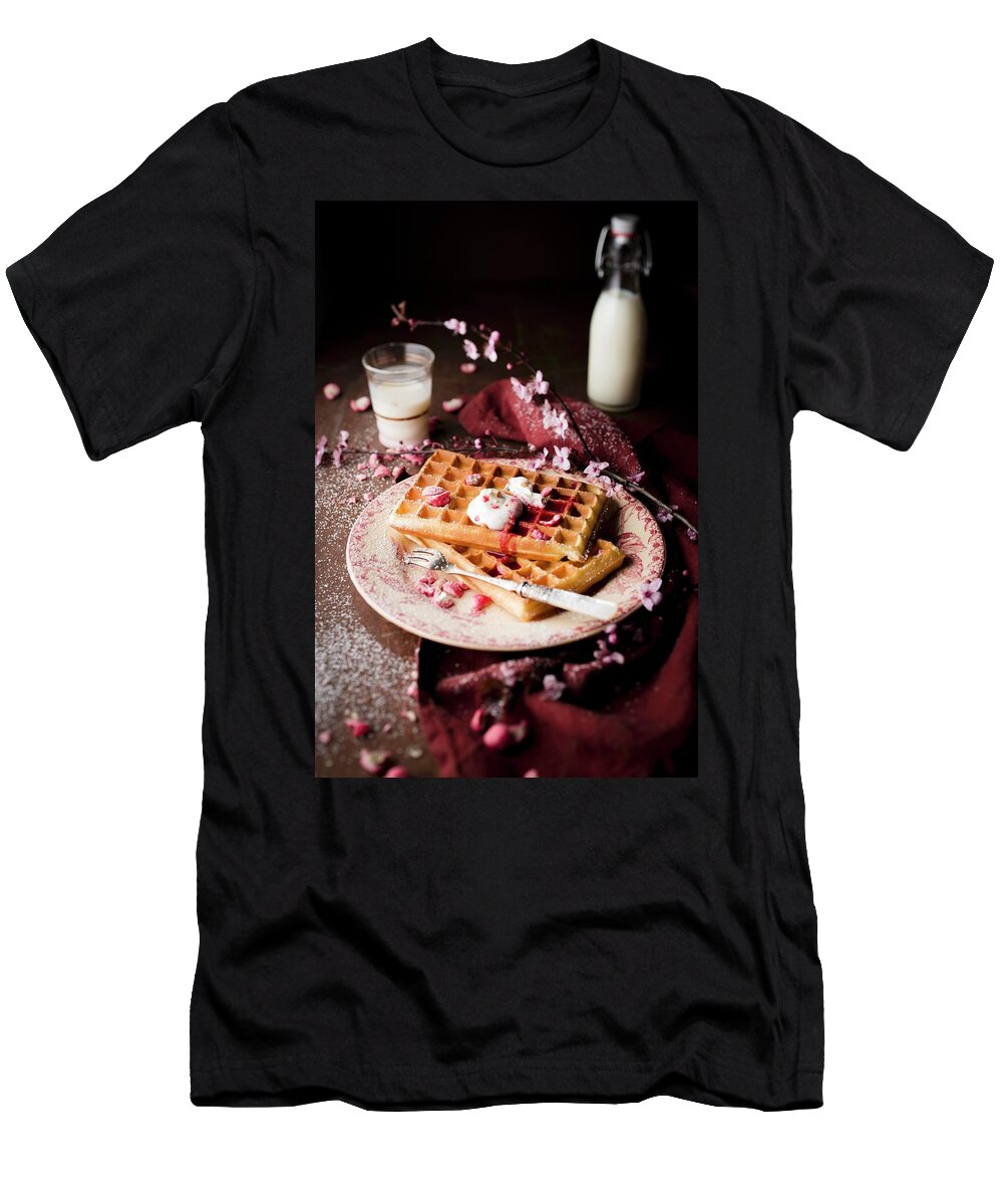 Ip_60354833 T-Shirt featuring the photograph Pile Of Plain Brussels Waffles With Red Berry Coulis, Cream And Pink Pralines And Icing Sugar by Hallet
