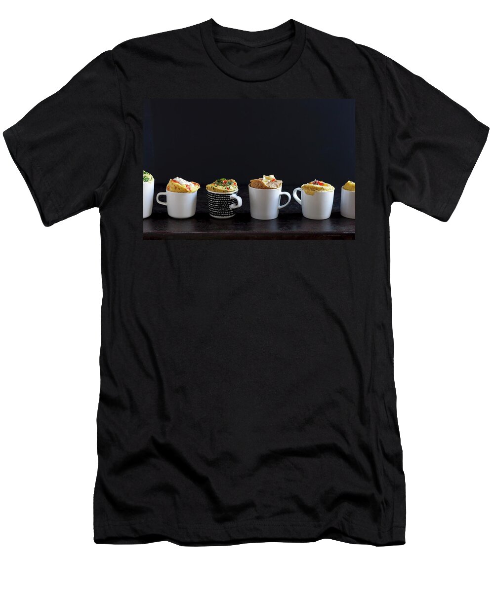 Ip_12316602 T-Shirt featuring the photograph Various Savoury Mug Cakes In Front Of A Black Background by Akiko Ida