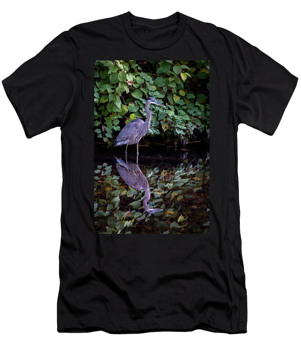 Bronx River T-Shirt featuring the photograph A Great Blue Heron and Its reflection in the Bronx River by Kevin Suttlehan