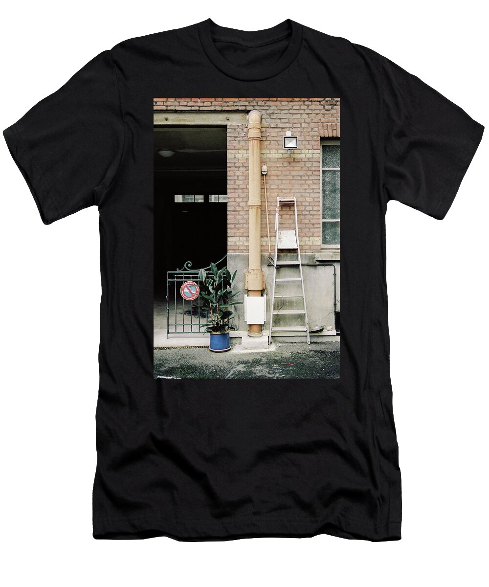 Building T-Shirt featuring the photograph Composition of building yard with plant and tools by Barthelemy De Mazenod