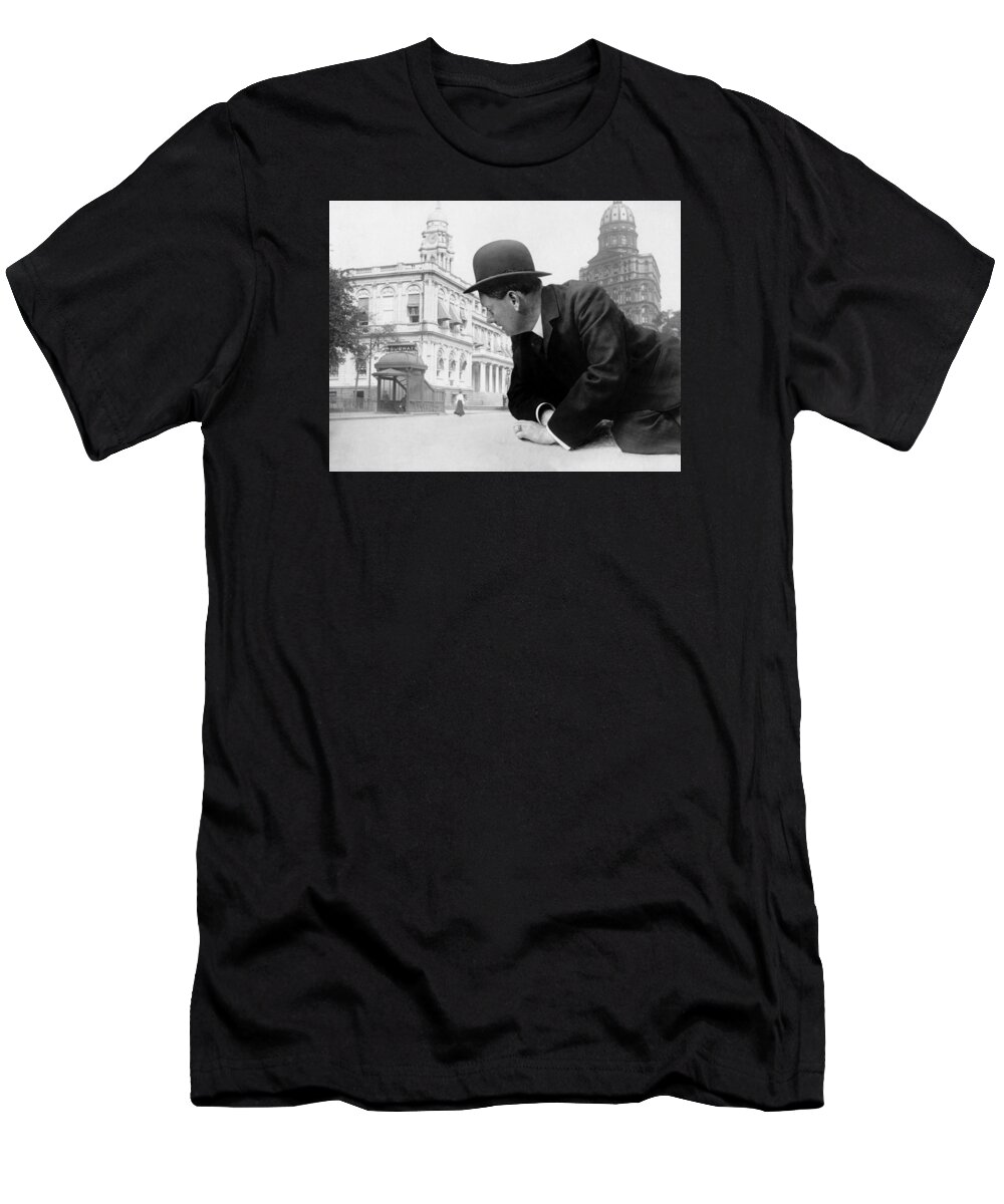 Illusion T-Shirt featuring the photograph Giant Man Looking At Subway Station - Vintage Photo Manipulation - Circa 1910 by War Is Hell Store