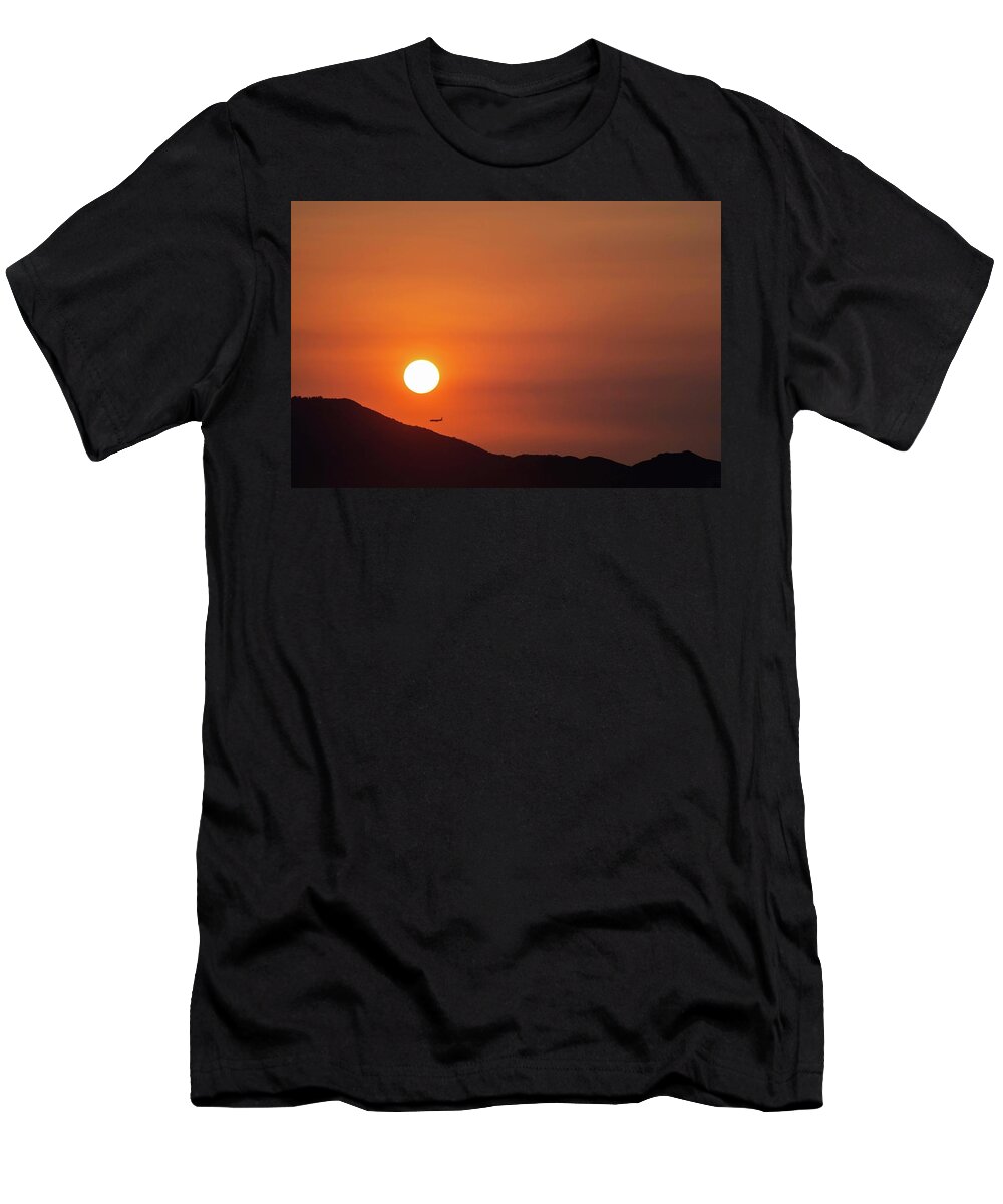 Sunset T-Shirt featuring the photograph Red sunset and plane in flight by Hannes Roeckel