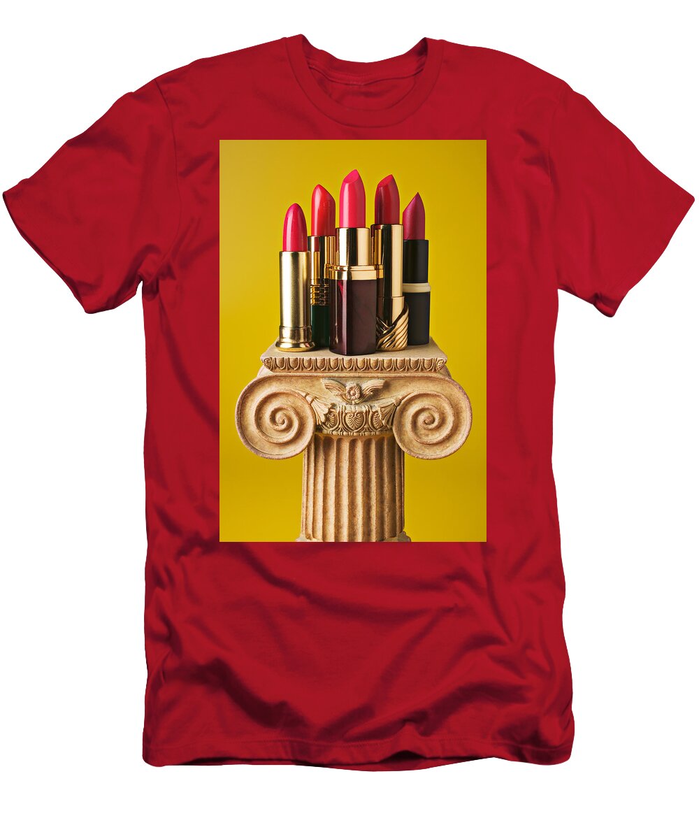 Cosmetics T-Shirt featuring the photograph Five red lipstick tubes on pedestal by Garry Gay