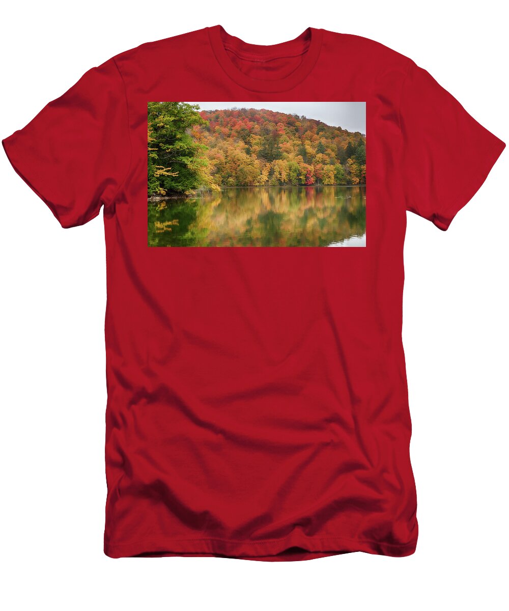 Abenaki T-Shirt featuring the photograph Vermont fall foliage reflected on Pogue Pond by Jeff Folger