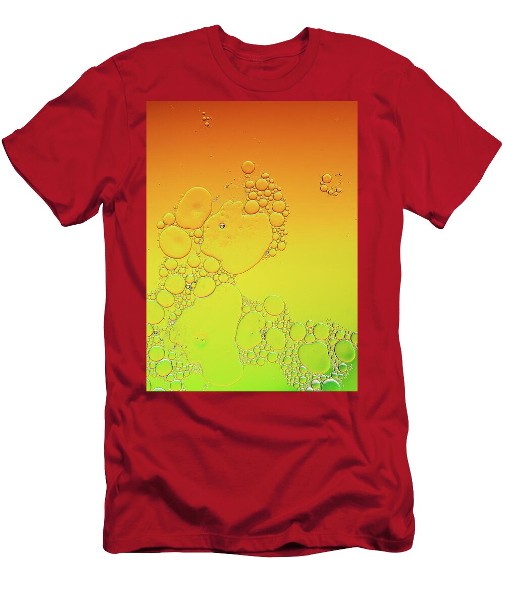 Connection T-Shirt featuring the photograph Bright abstract, yellow background with flying bubbles by Michalakis Ppalis