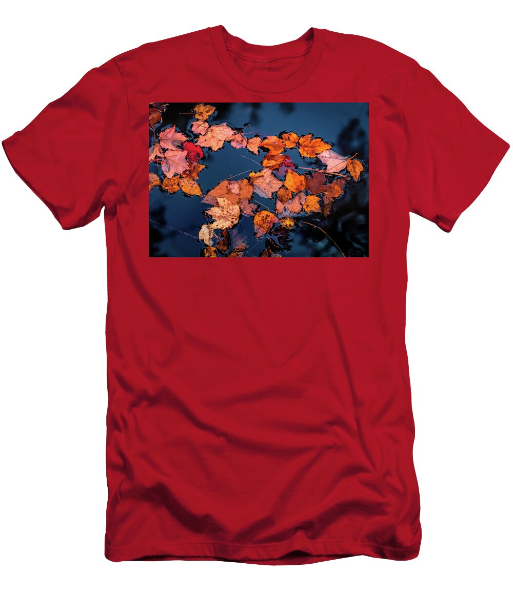 Fallen Autumn Leaves T-Shirt featuring the photograph Autumn leaves in the blue water by Lilia S