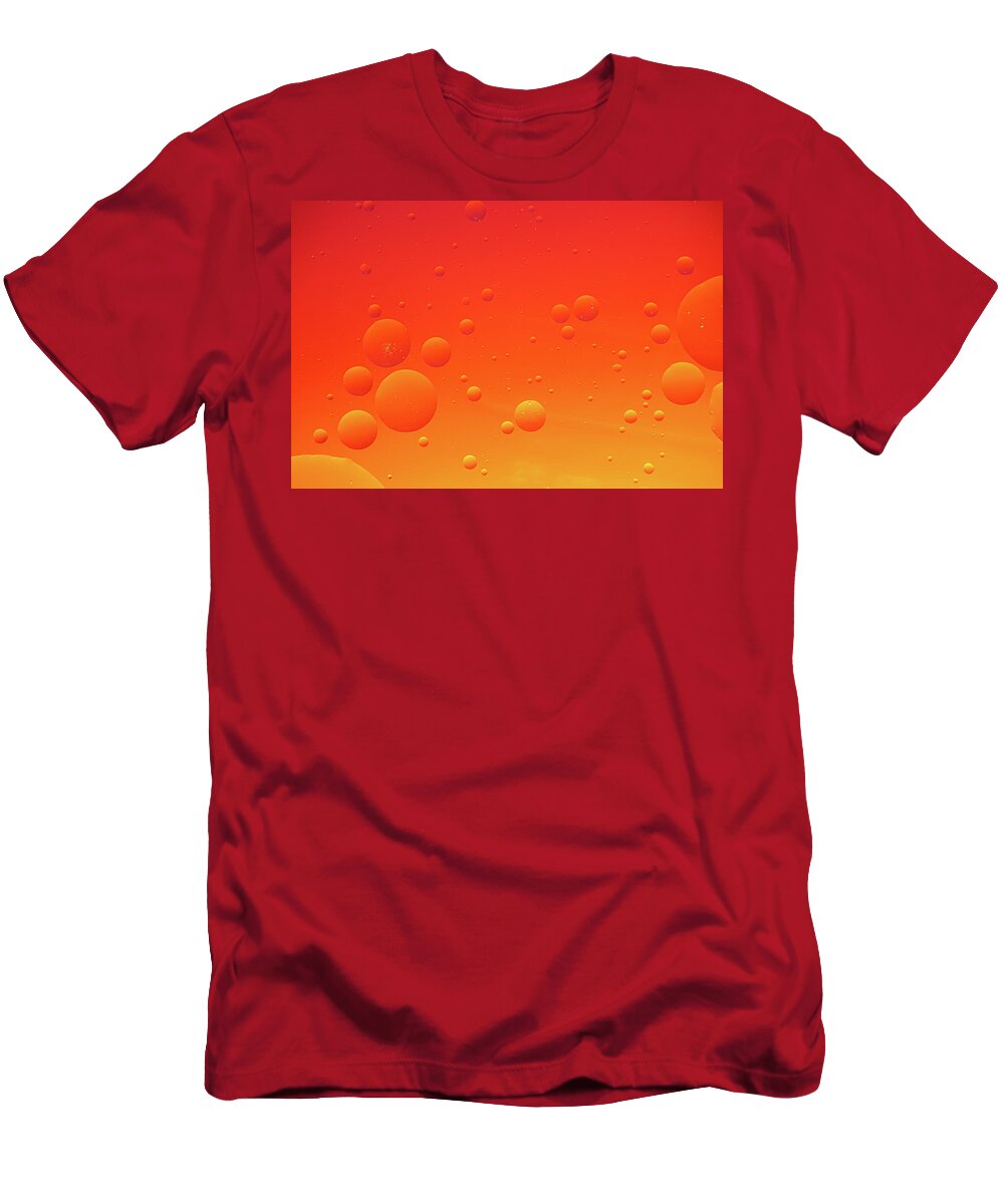 Abstract T-Shirt featuring the photograph Bright abstract, red background with flying bubbles by Michalakis Ppalis
