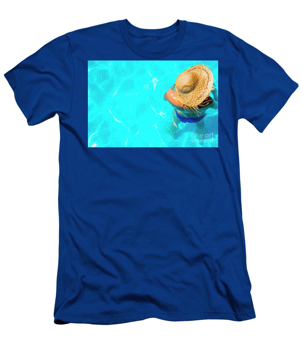 Beautiful T-Shirt featuring the photograph Woman in a pool with hat relaxed and rested. #4 by Joaquin Corbalan