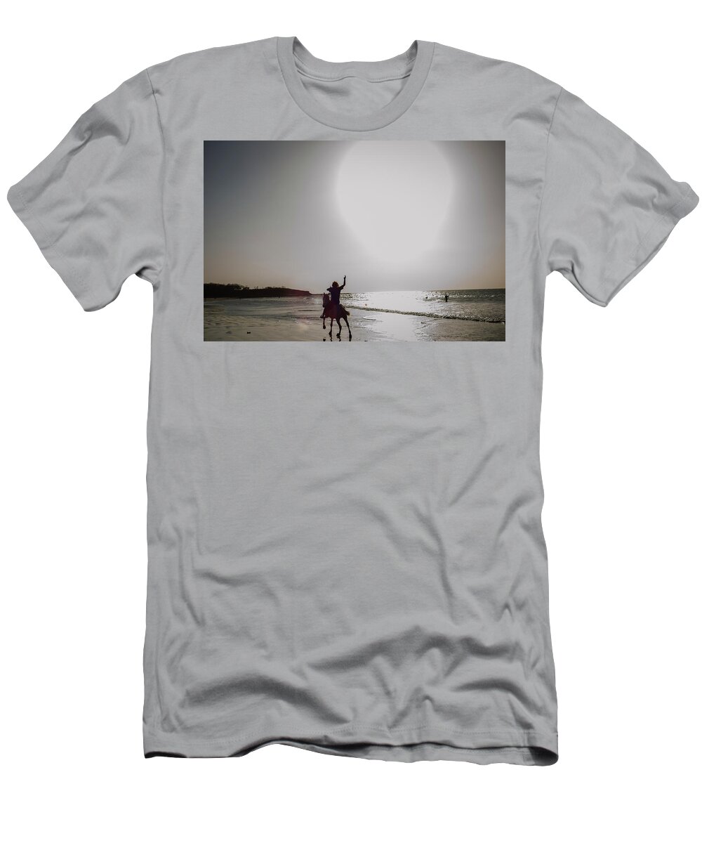 Water's Edge T-Shirt featuring the photograph A Man Rides His Horse On The Beach by Todd Korol