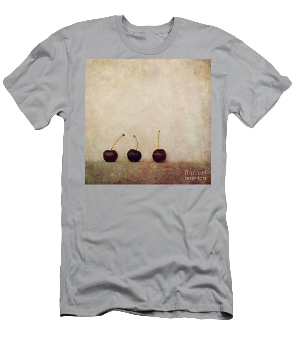 Minimalist Still Life Image With Three Cherries On A Board. T-Shirt featuring the photograph Cherries by Priska Wettstein