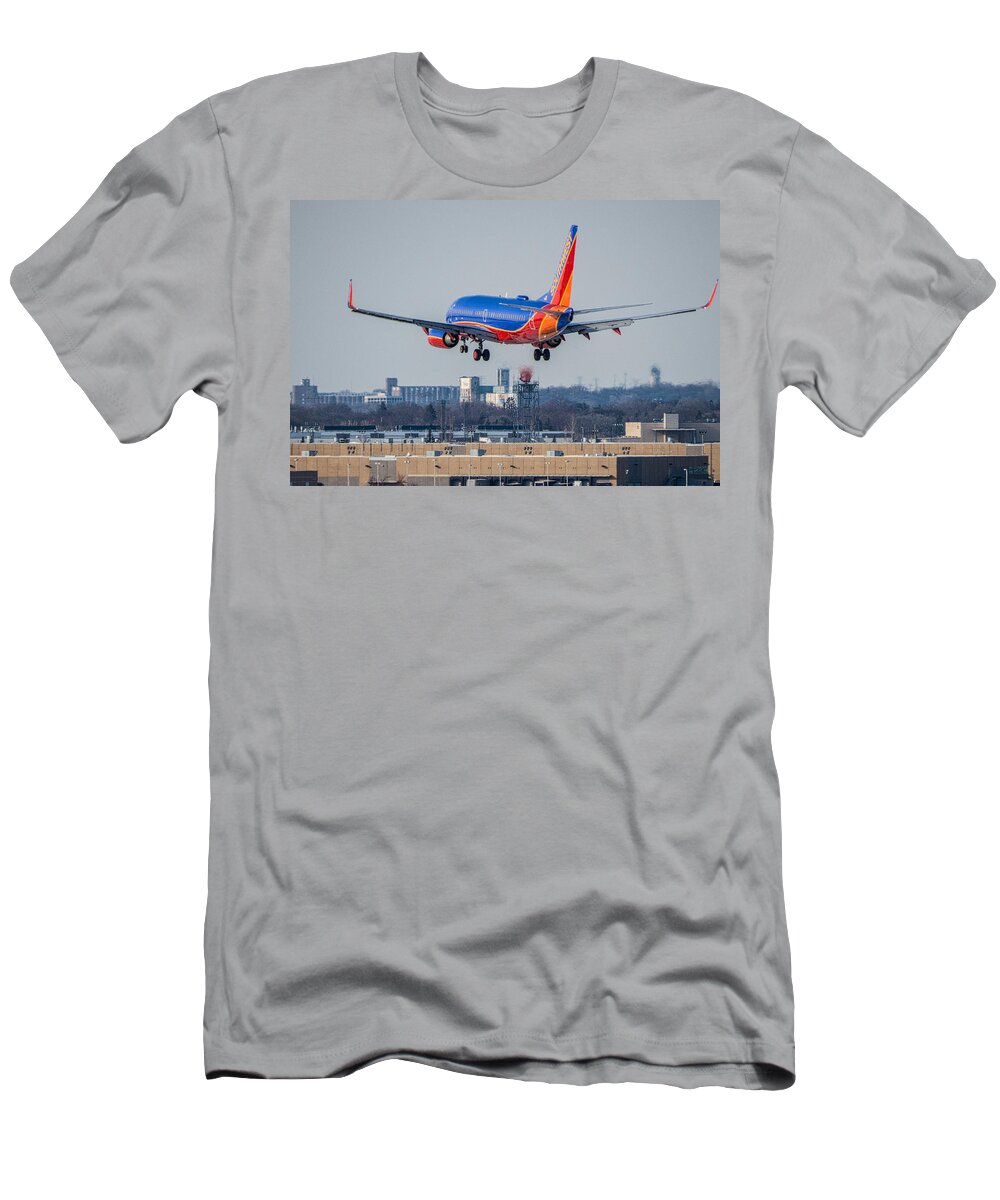 Southwest Airlines Airplane Plane Flight Fly Flying Jet Airliner Blue Red Orange Landing Gear Wings Tail Flaps Sky Msp Airport Minneapolis St. Paul International T-Shirt featuring the photograph Cleared for Landing by Tom Gort