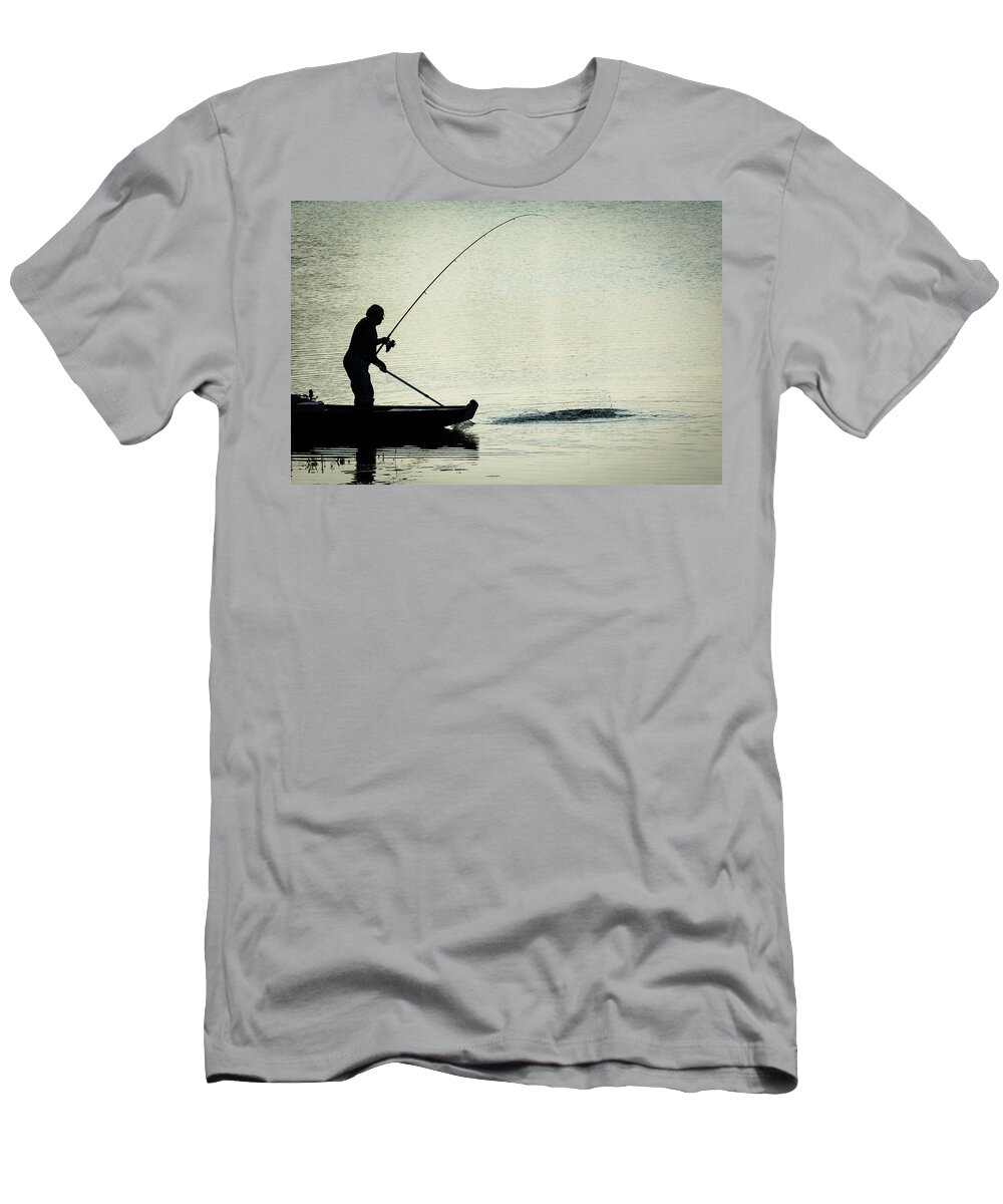 Fisher T-Shirt featuring the photograph Fisherman Catching Fish On A Twilight Lake by Andreas Berthold
