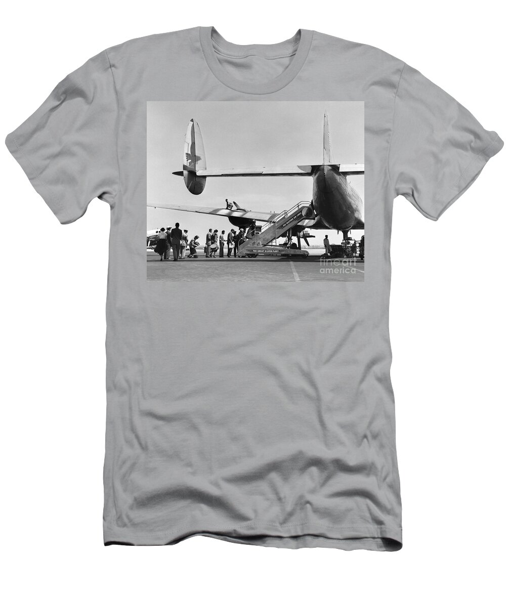 1950s T-Shirt featuring the photograph Passengers Boarding A Plane #1 by C.S. Bauer/ClassicStock