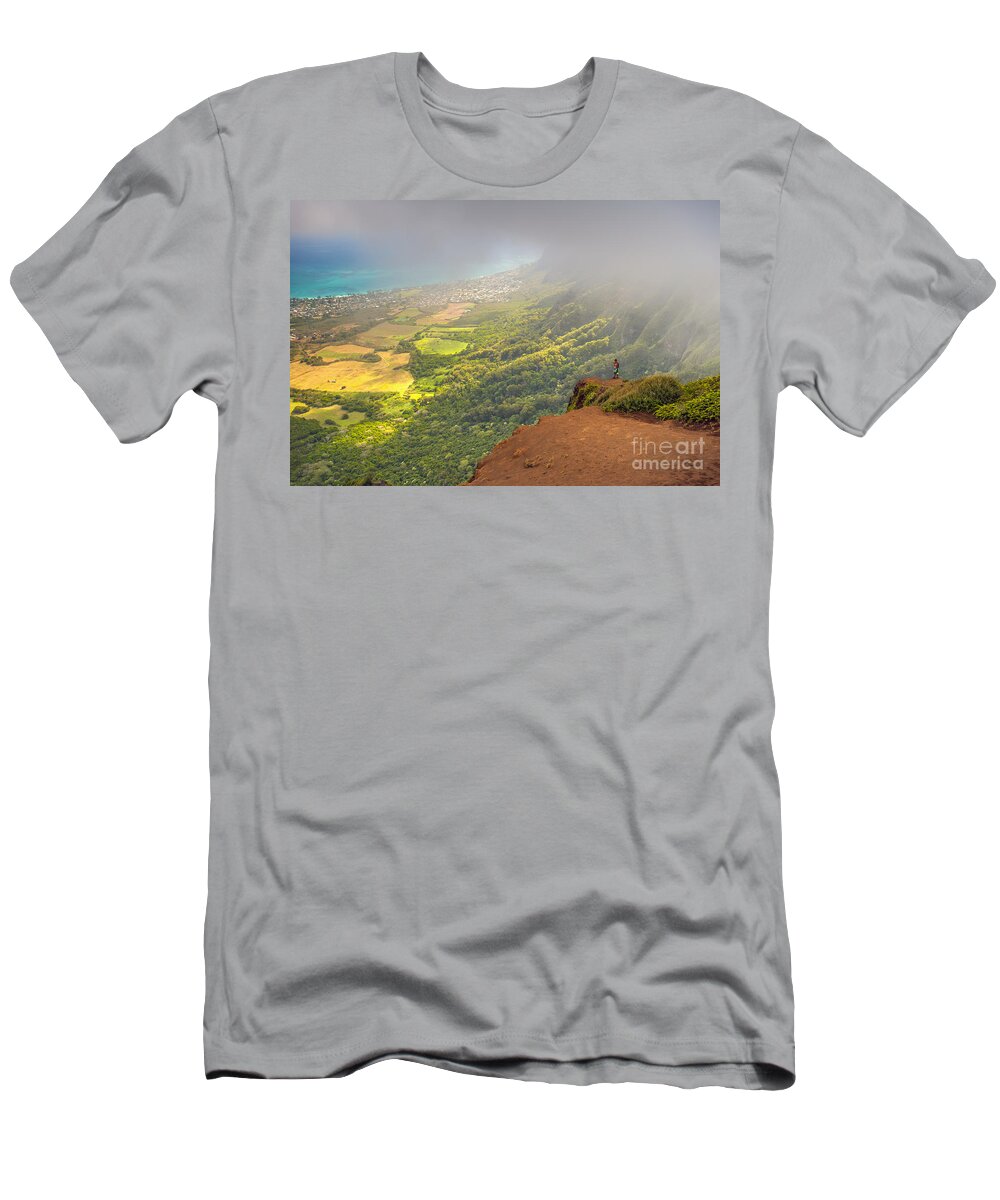 Backpacking T-Shirt featuring the photograph A Man Standing On The Edge Of A Cliff by Michael Jones