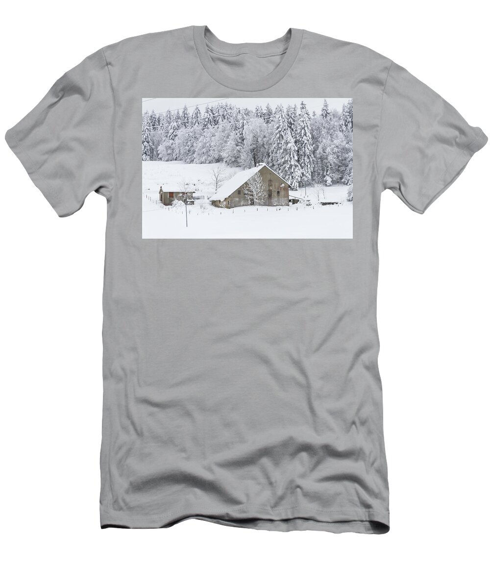 Snowy Landscape T-Shirt featuring the photograph An old farmhouse in the snow by Paul MAURICE
