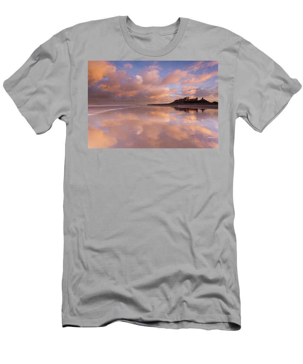 Bamburgh Castle T-Shirt featuring the photograph Bamburgh Castle sunset reflections on the beach by Anita Nicholson