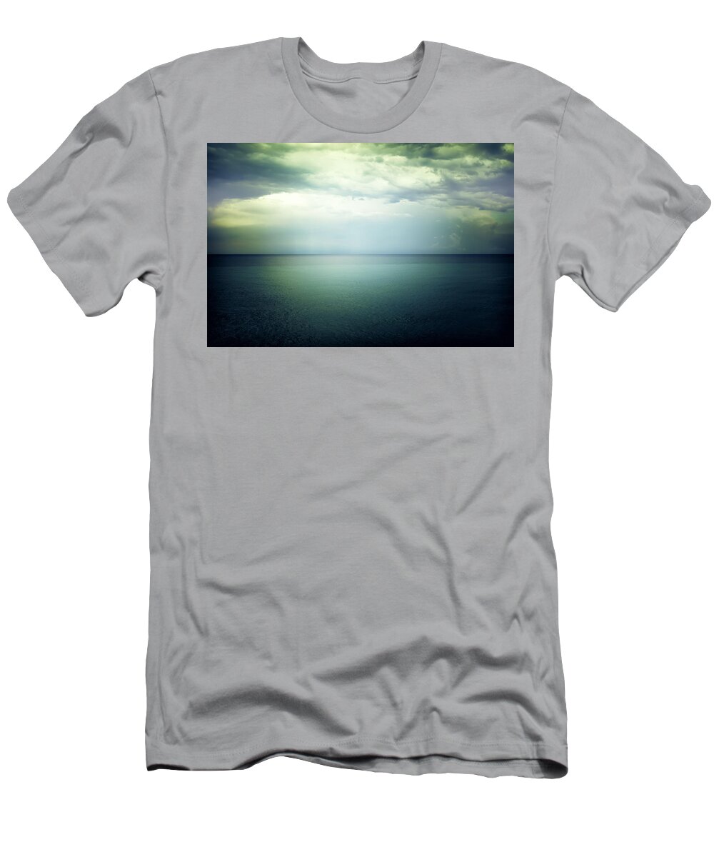 Sea T-Shirt featuring the photograph Light in the sky above the dark gloomy sea by GoodMood Art