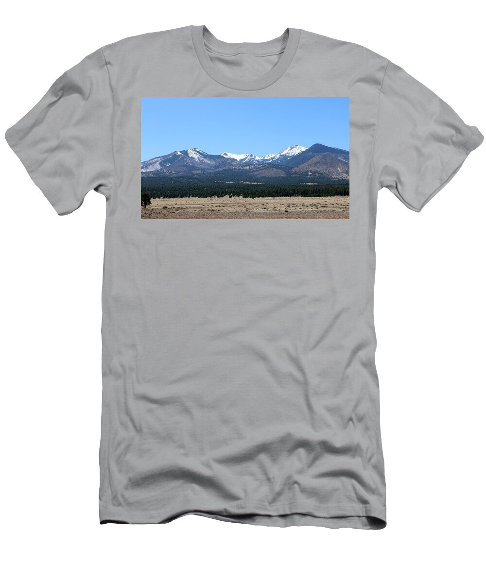 Sunset Crater National Monument T-Shirt featuring the photograph San Francisco Peaks at Sunset Crater Volcano National Monument by Christy Pooschke