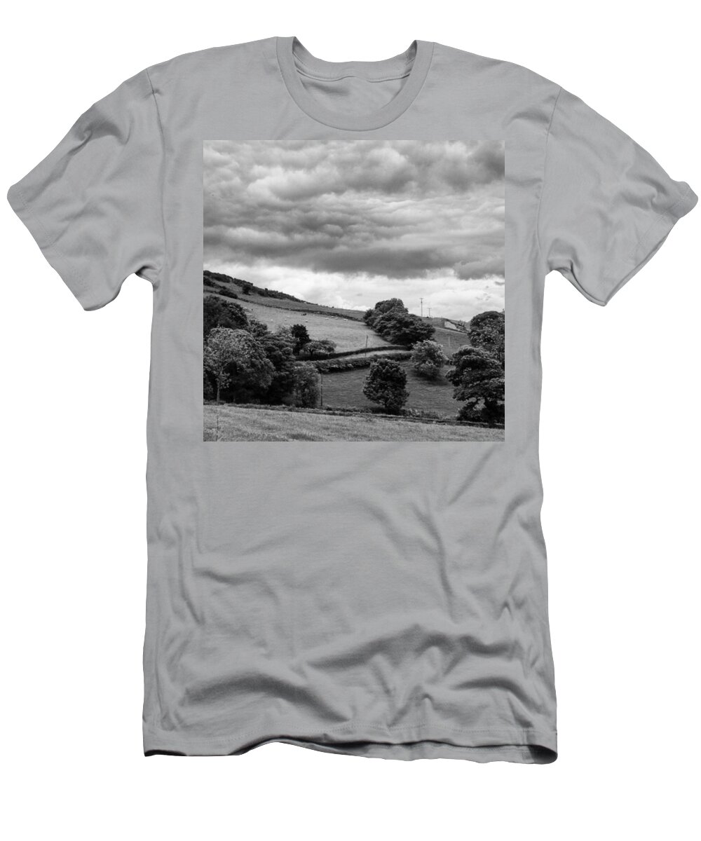 T-Shirt featuring the photograph The Rolling Hills And Looming Clouds by Aleck Cartwright