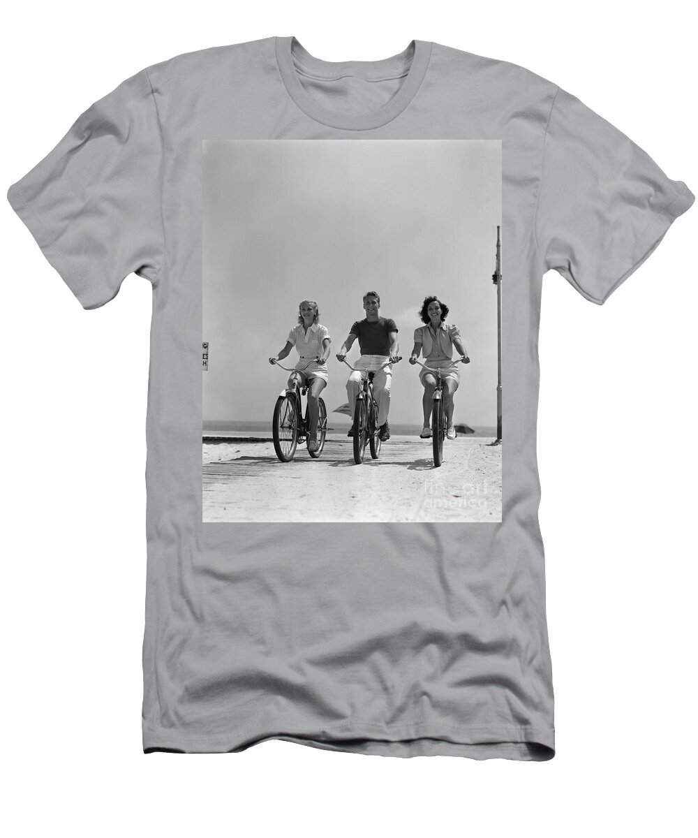 1940s T-Shirt featuring the photograph Young People Biking On The Beach by H Armstrong Roberts and ClassicStock