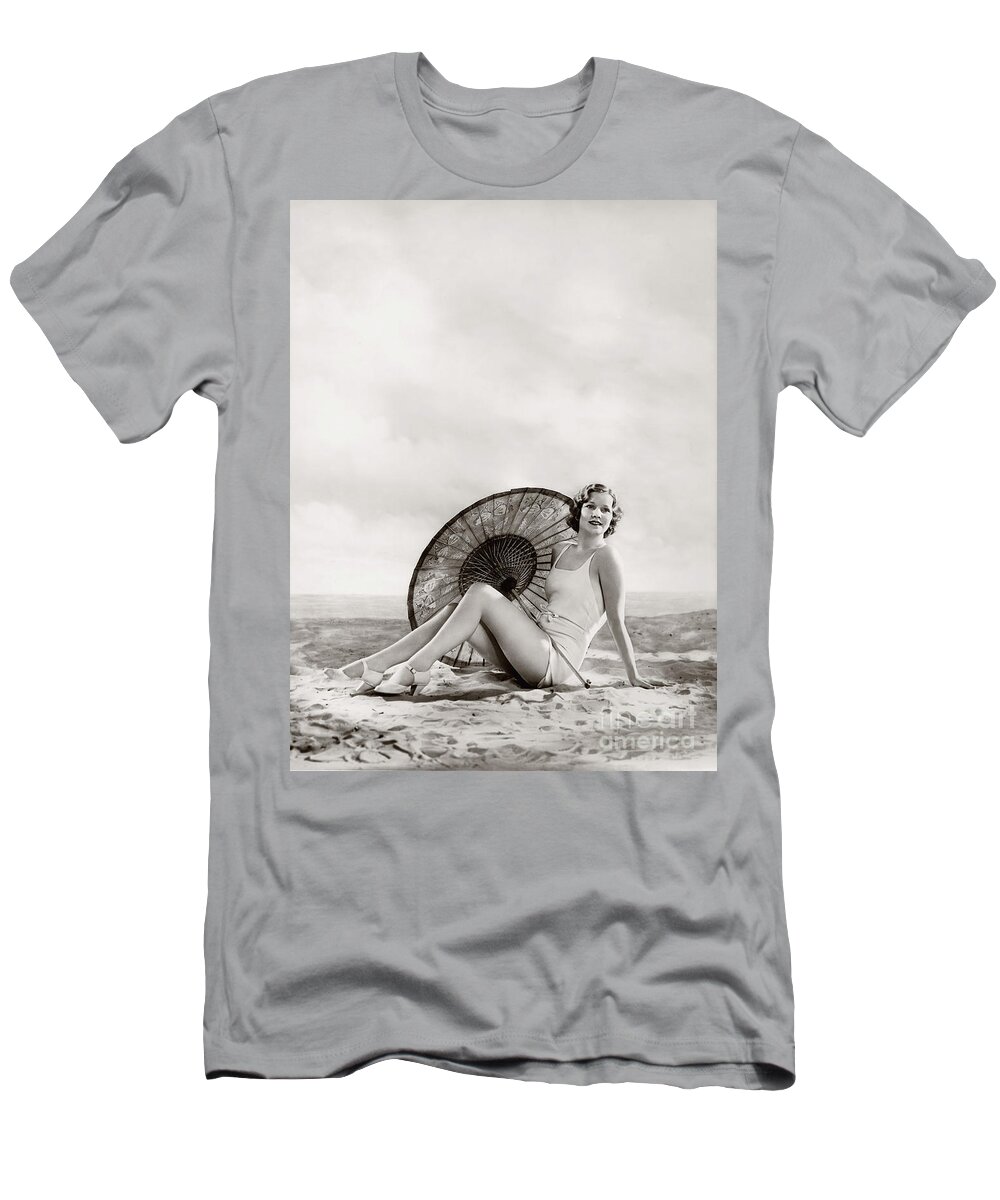 Ziegfeld T-Shirt featuring the photograph Ziegfeld Model sun bathing on the beach by Alfred Cheney Johnston by Vintage Collectables