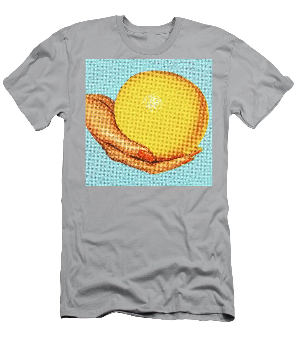 Blue Background T-Shirt featuring the drawing Woman's Hand Holding a Grapefruit by CSA Images