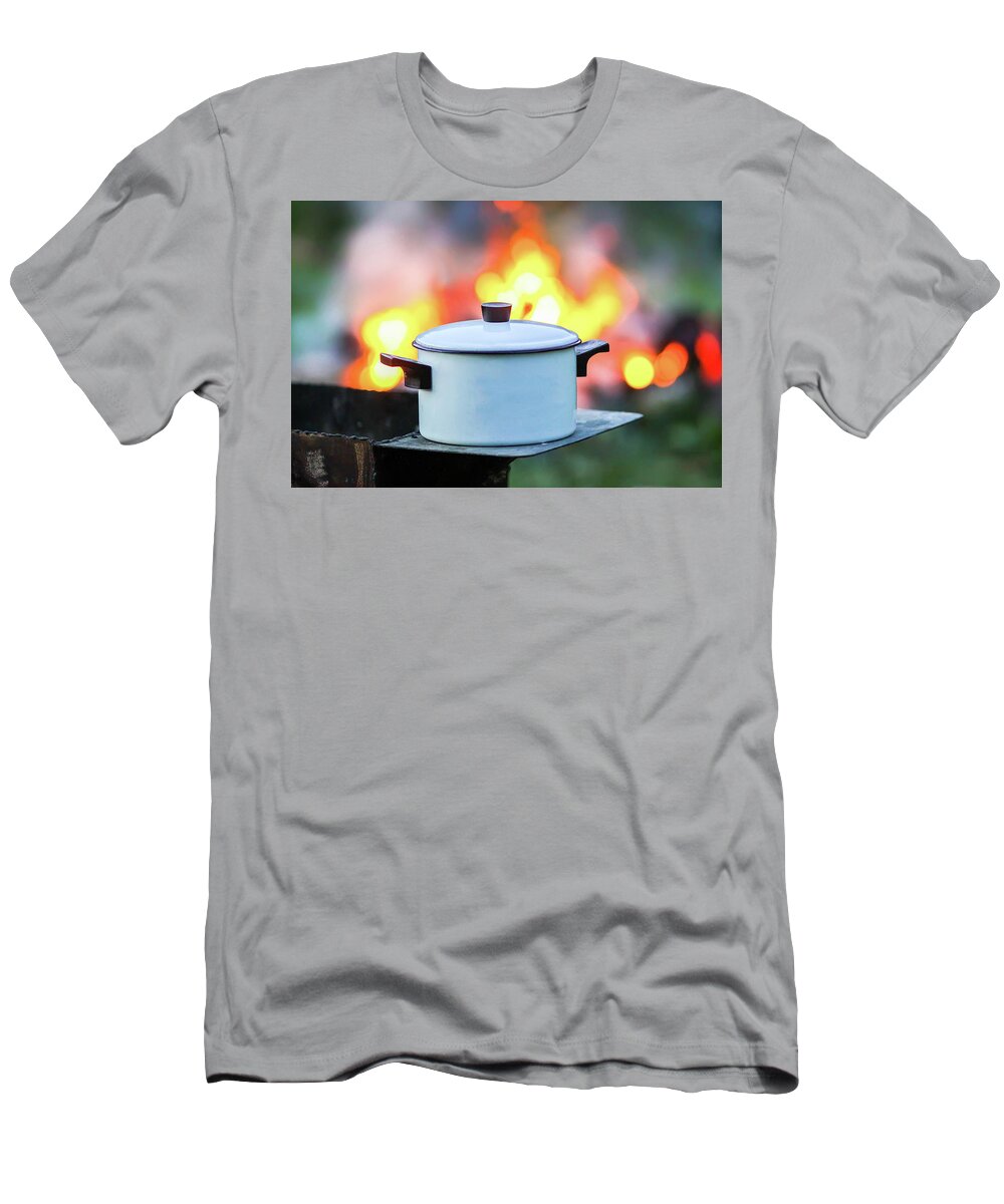 Barbecue T-Shirt featuring the photograph Meat on the grill and white pan on the brazier on bonfire background #1 by Olga Strogonova