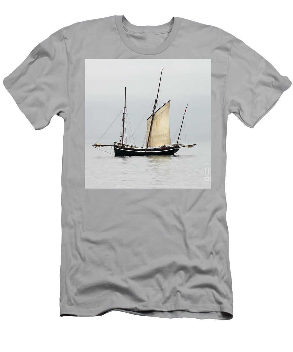 Lugger T-Shirt featuring the photograph A Cornish Lugger becalmed in Mounts Bay, Cornwall. by Tony Mills