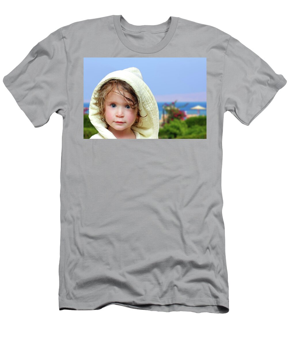 Childhood T-Shirt featuring the photograph Cute Girl In Bathrobe On Beach by Mikhail Kokhanchikov