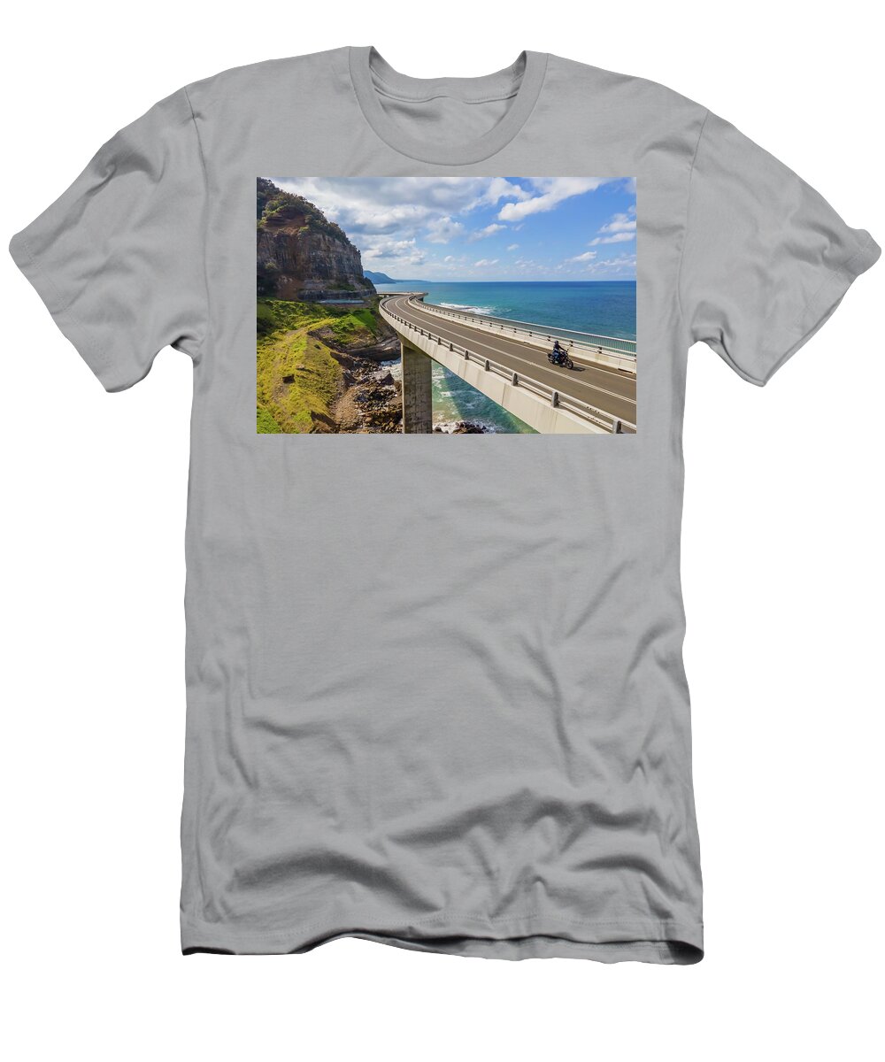 Bridge T-Shirt featuring the photograph Sea Cliff Bridge and a Lone Biker by Andre Petrov