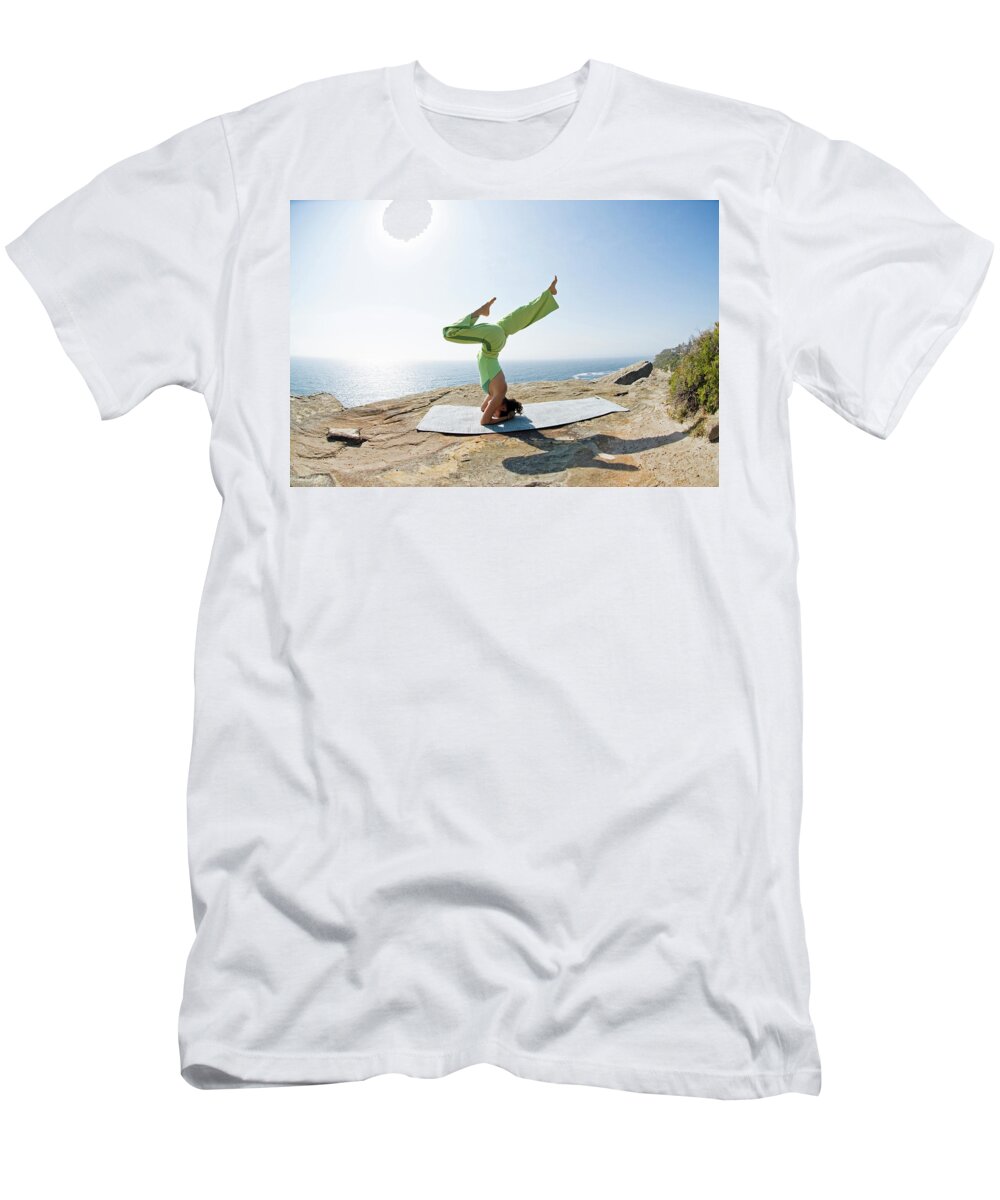 Australia T-Shirt featuring the photograph A Woman Is Practicing Yoga On A Rocky #1 by Lars Schneider