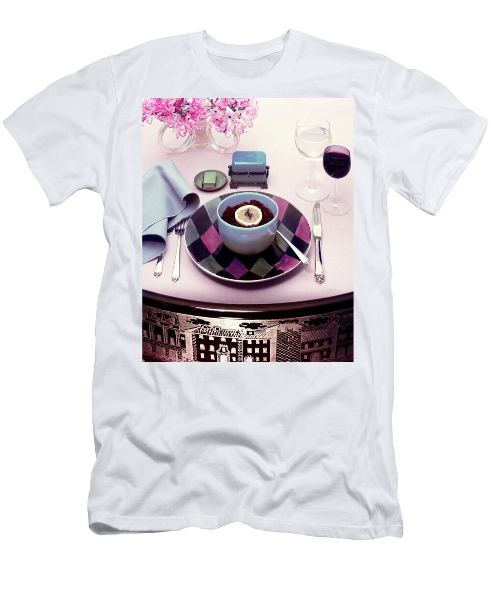 Studio Shot T-Shirt featuring the photograph A Bowl Of Food On A Pink Table by Haanel Cassidy