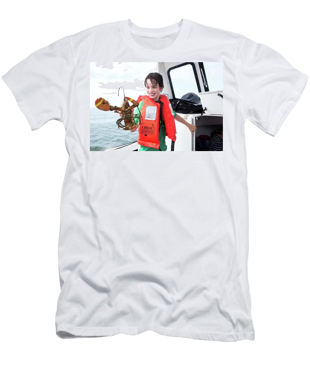 Boat T-Shirt featuring the photograph A Boy Holds A Lobster On A Boat by Julia Cumes