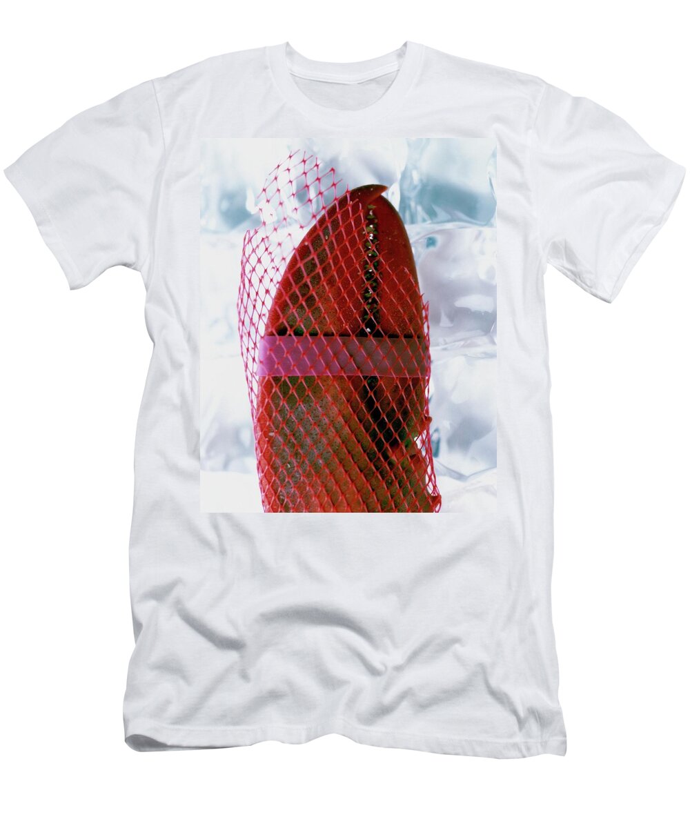 Cooking T-Shirt featuring the photograph A Lobster Claw In Red Packaging by Romulo Yanes