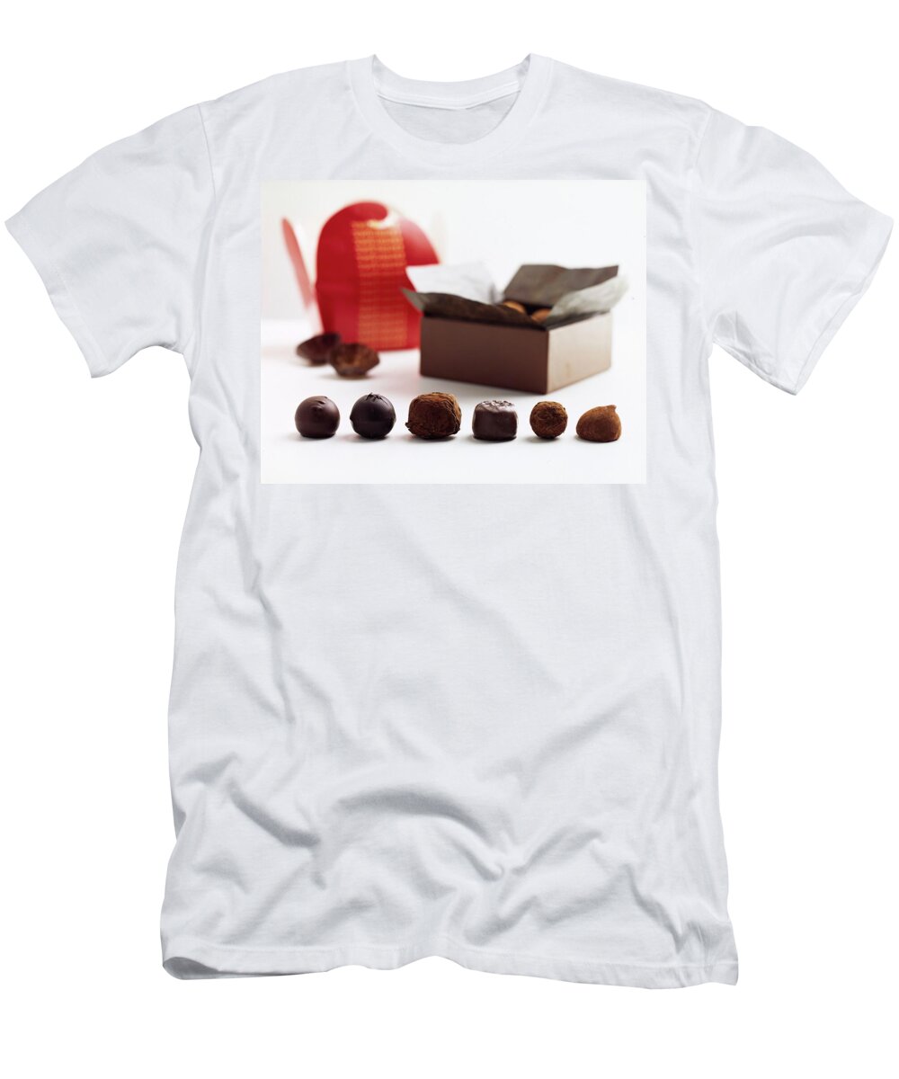 Cooking T-Shirt featuring the photograph A Still Life Photo Of Gourmet Chocolates by Romulo Yanes