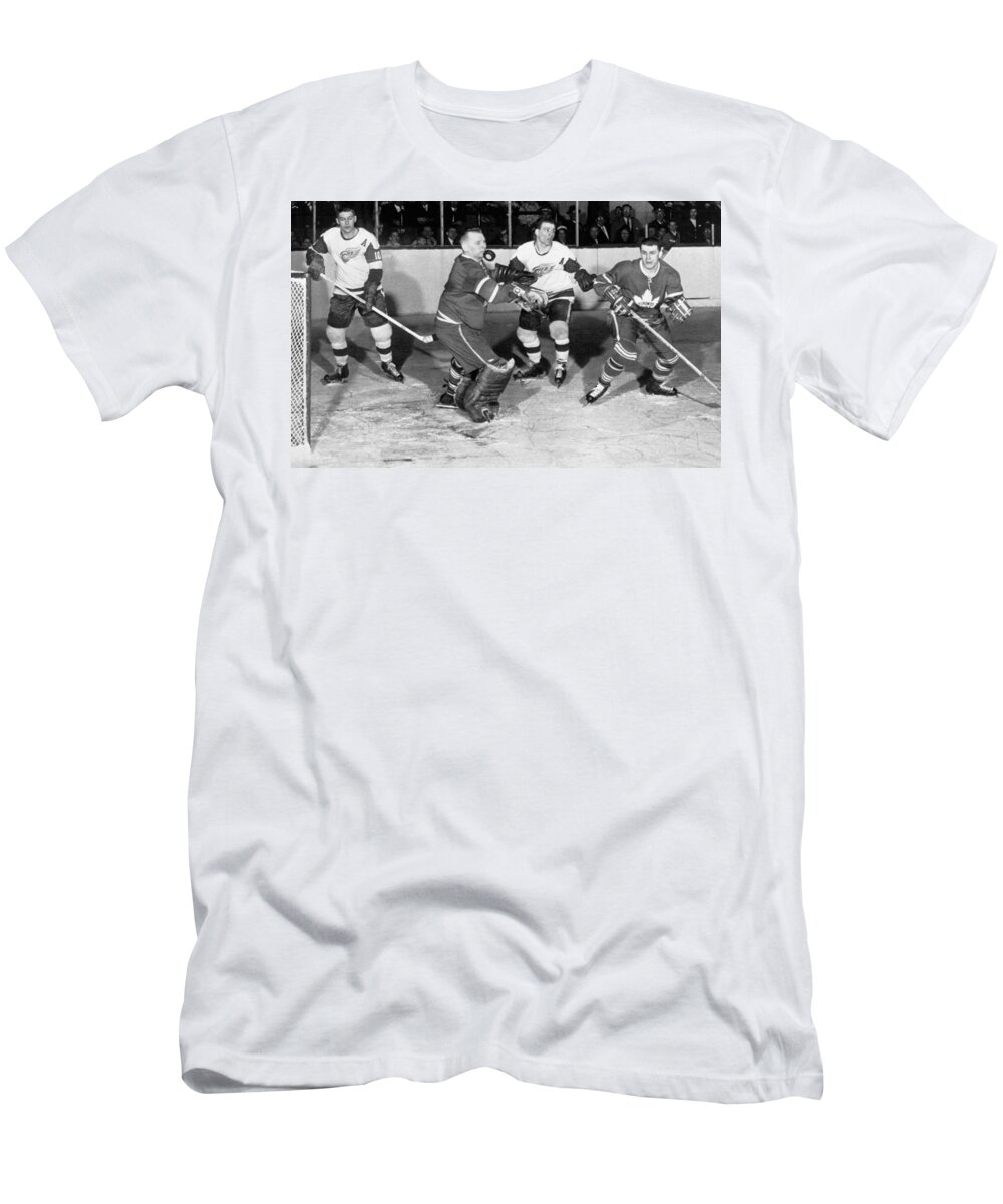 1950s T-Shirt featuring the photograph Hockey Goalie Chin Stops Puck by Underwood Archives