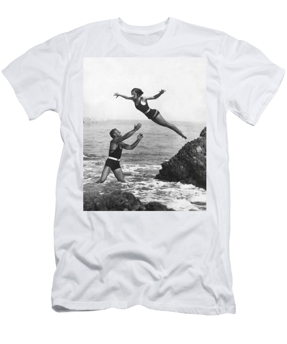 1920s T-Shirt featuring the photograph Leap Into Life Guard's Arms by Underwood Archives