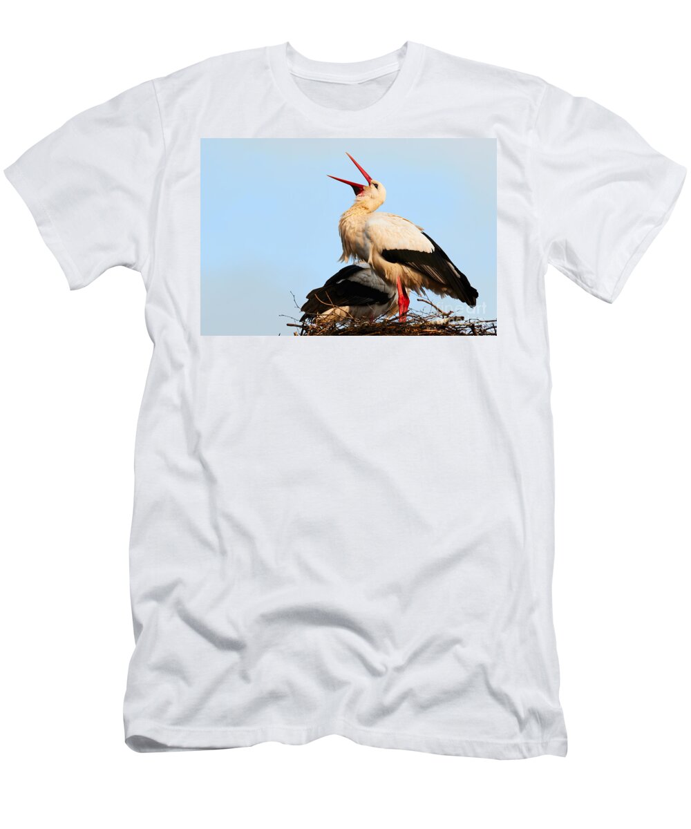 Two T-Shirt featuring the photograph Two white storks on a nest by Nick Biemans