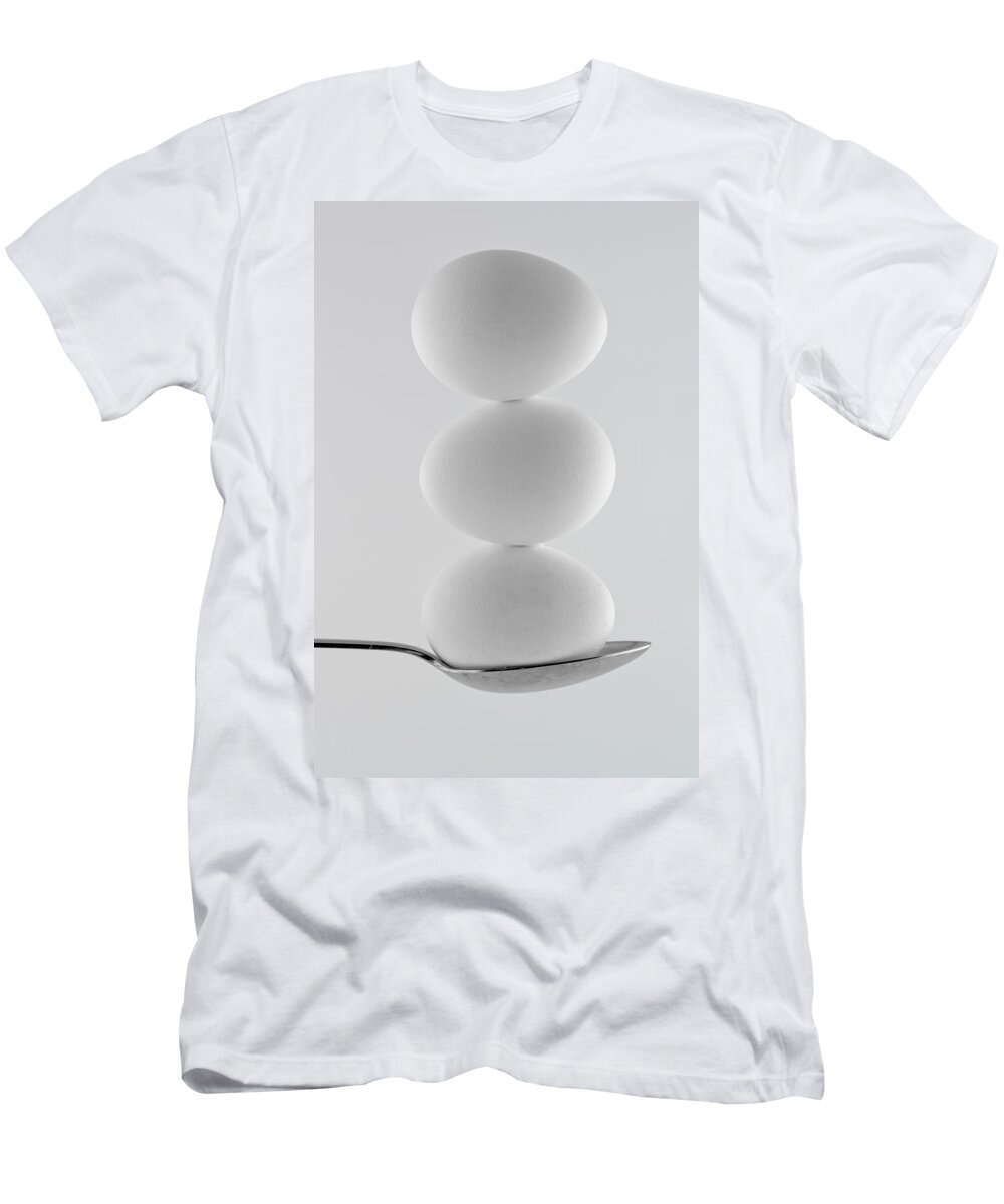 Balance T-Shirt featuring the photograph Balancing Eggs by Gert Lavsen
