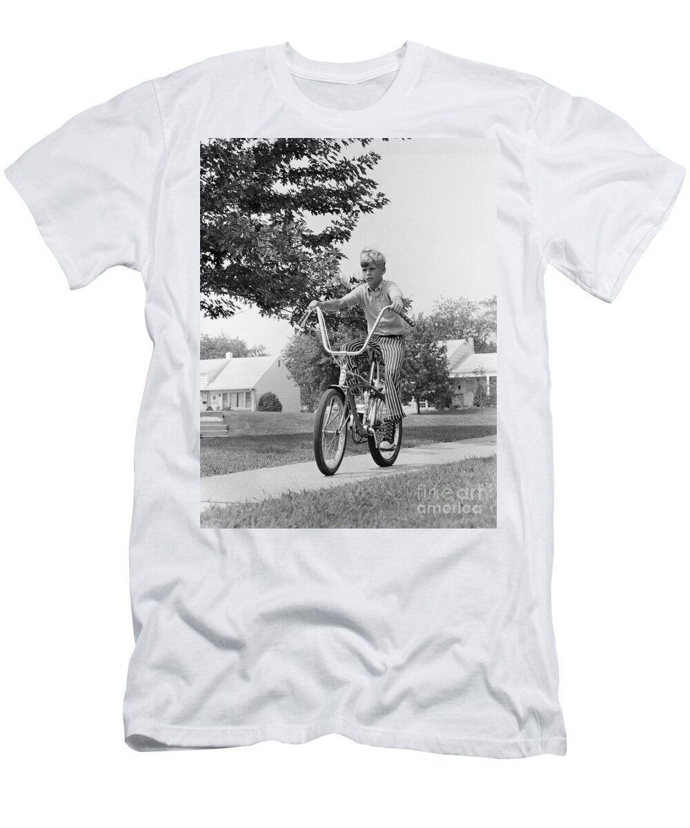 1970s T-Shirt featuring the photograph Boy Riding Bike On Suburban Sidewalk by H. Armstrong Roberts/ClassicStock